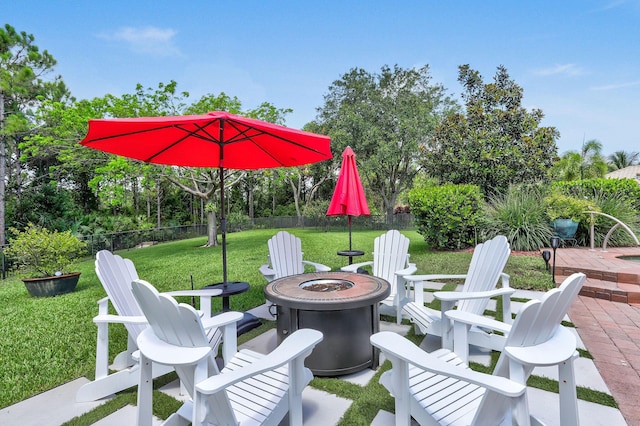 7668 SE Laque Cir, Stuart, FL 34997 - view of patio with a fire pit and view of scattered trees
