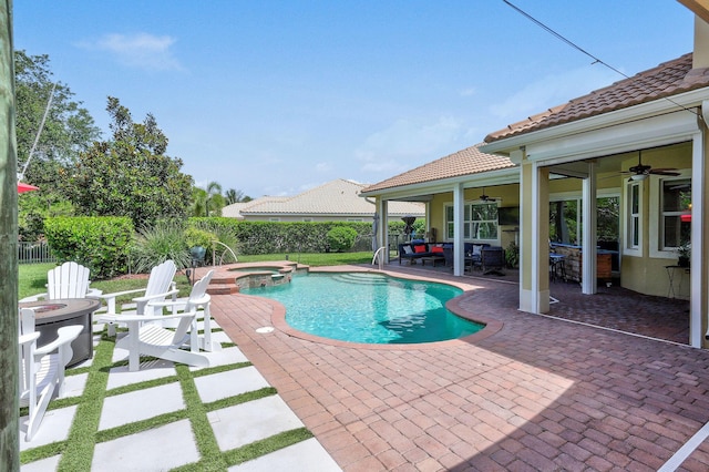 7668 SE Laque Cir, Stuart, FL 34997 - view of pool with ceiling fan, a patio area, a pool with connected hot tub, and an outdoor living space with a fire pit