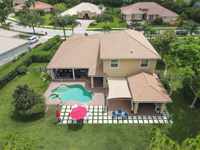 7668 SE Laque Cir, Stuart, FL 34997 - view of swimming pool featuring a patio, a pool with connected hot tub, and a residential view