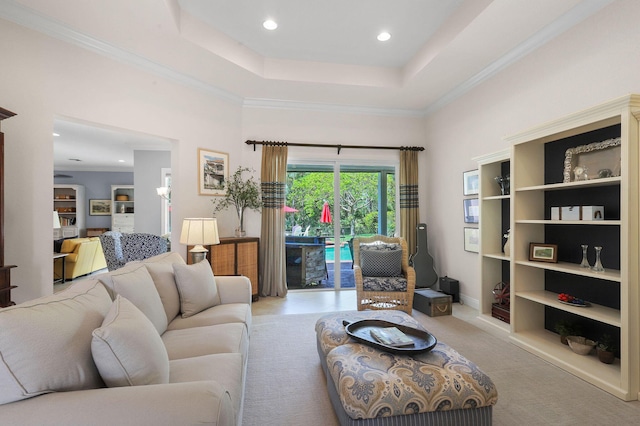7668 SE Laque Cir, Stuart, FL 34997 - living room featuring a tray ceiling, recessed lighting, and ornamental molding