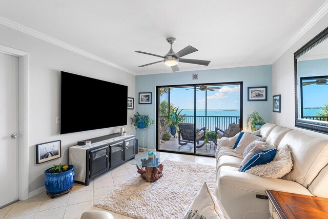 20 NE Plantation Rd Unit 203, Stuart, FL 34996 - living area featuring light tile patterned flooring, ornamental molding, a ceiling fan, and baseboards