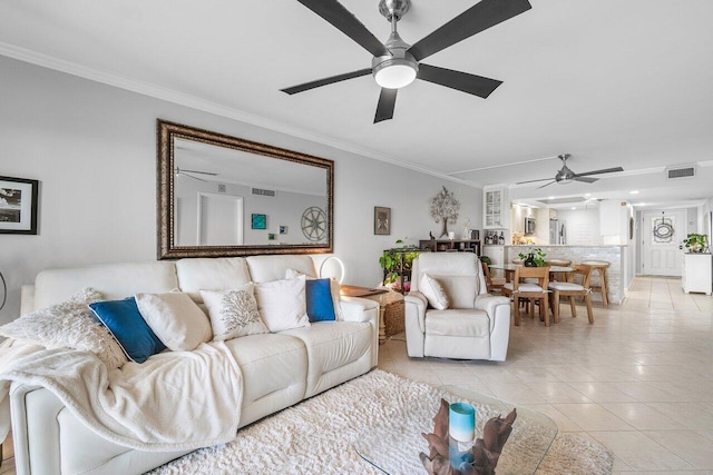 20 NE Plantation Rd Unit 203, Stuart, FL 34996 - living area featuring a ceiling fan, ornamental molding, and light tile patterned floors