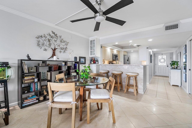 20 NE Plantation Rd Unit 203, Stuart, FL 34996 - dining area with crown molding, light tile patterned flooring, ceiling fan, and baseboards