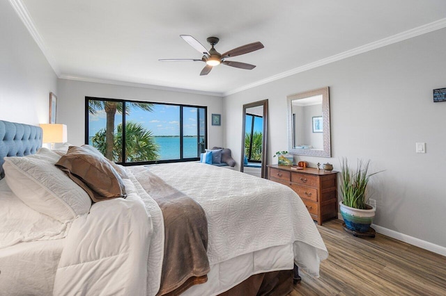 20 NE Plantation Rd Unit 203, Stuart, FL 34996 - bedroom featuring wood finished floors, baseboards, crown molding, and ceiling fan