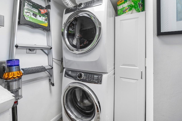 20 NE Plantation Rd Unit 203, Stuart, FL 34996 - laundry area featuring stacked washer / dryer