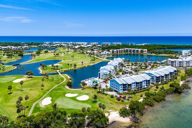 20 NE Plantation Rd Unit 203, Stuart, FL 34996 - bird's eye view of apartment complex / building, a local golf course, and a large body of water
