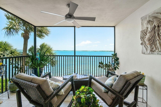 20 NE Plantation Rd Unit 203, Stuart, FL 34996 - sunroom with a water view, floor to ceiling windows, a textured ceiling, and healthy amount of natural light