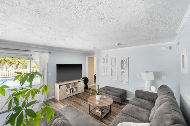 3056 SE Morningside Blvd, Port Saint Lucie, FL 34952 - living area featuring wood finished floors, crown molding, a textured ceiling, and baseboards