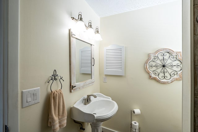 3056 SE Morningside Blvd, Port Saint Lucie, FL 34952 - bathroom with a sink and a textured ceiling
