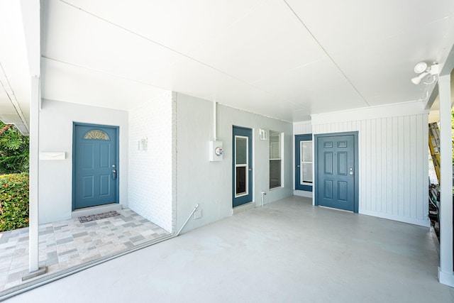 3056 SE Morningside Blvd, Port Saint Lucie, FL 34952 - property entrance featuring covered porch and brick siding