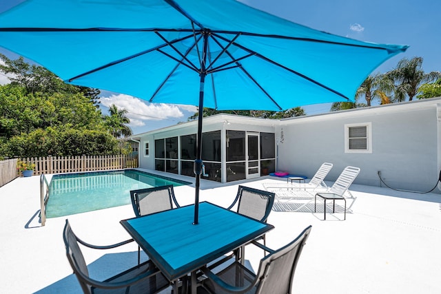 3056 SE Morningside Blvd, Port Saint Lucie, FL 34952 - view of pool featuring a patio, a sunroom, and outdoor dining area