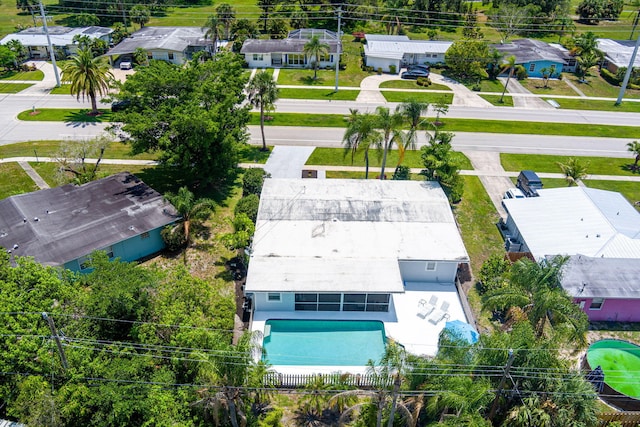 3056 SE Morningside Blvd, Port Saint Lucie, FL 34952 - aerial perspective of suburban area with a pool area