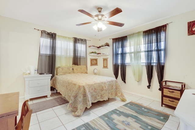 bedroom featuring light tile patterned floors and ceiling fan