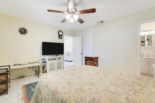 unfurnished bedroom with tile patterned floors, a sink, connected bathroom, and ceiling fan