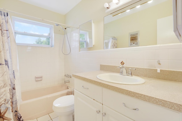full bath featuring shower / tub combo, vanity, toilet, tile patterned flooring, and tile walls