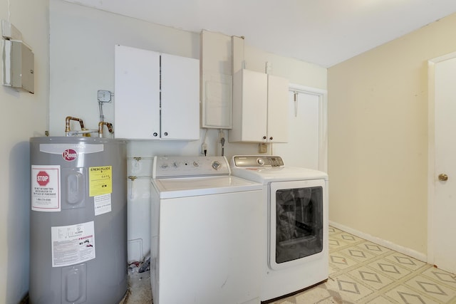 laundry room featuring electric water heater, cabinet space, separate washer and dryer, light flooring, and baseboards