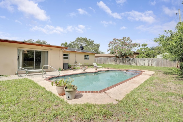 view of pool featuring central air condition unit, a patio, and a pool with connected hot tub