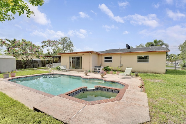 back of property featuring stucco siding, a patio area, and a pool with connected hot tub