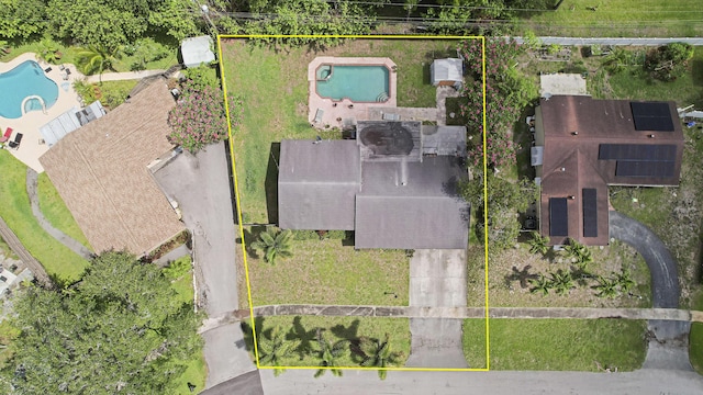 aerial overview of property's location with a pool area and property boundaries highlighted