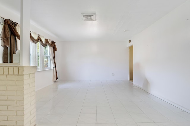 empty room with light tile patterned floors
