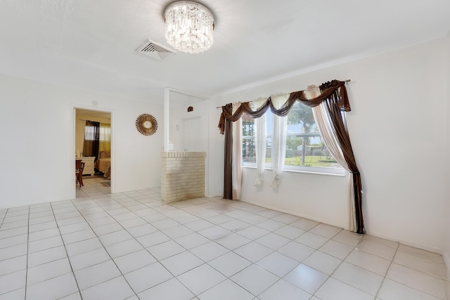 empty room featuring a chandelier