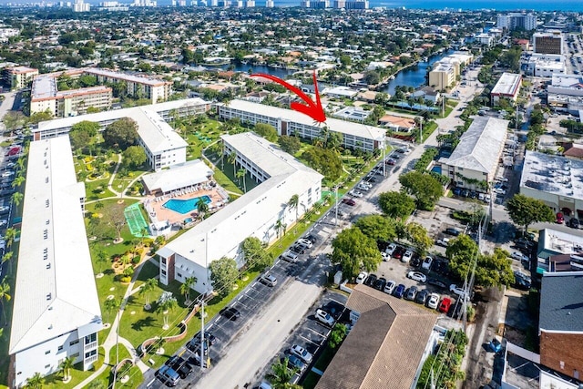 view of property location with nearby urban area and a nearby body of water