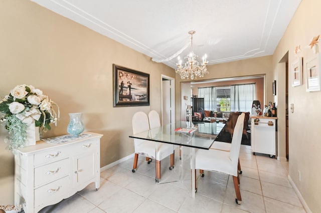 103 SW 18th St, Boynton Beach, FL 33426 - dining space featuring a chandelier, light tile patterned floors, and baseboards