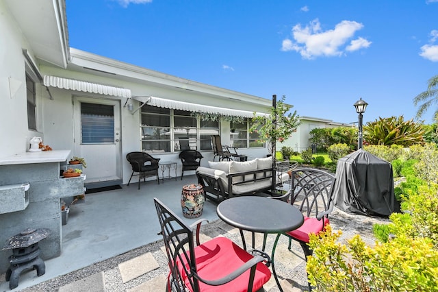 103 SW 18th St, Boynton Beach, FL 33426 - view of patio with an outdoor living space