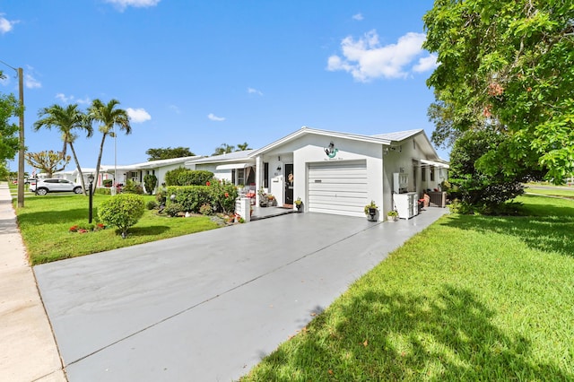 103 SW 18th St, Boynton Beach, FL 33426 - ranch-style house with concrete driveway, a garage, a front yard, and stucco siding