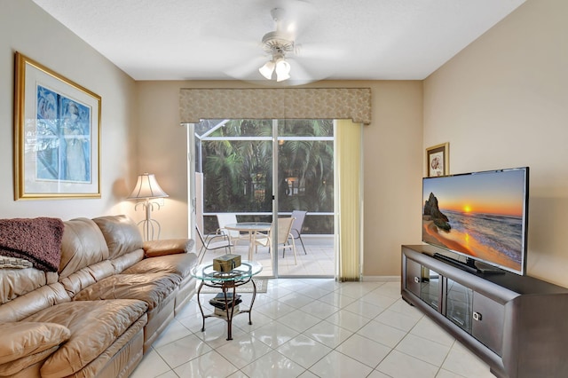 9620 Crescent View Dr N, Boynton Beach, FL 33437 - living area featuring ceiling fan, light tile patterned floors, and baseboards