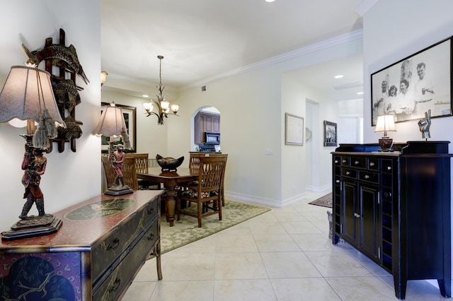 112 Palm Bay A Dr Unit A, Palm Beach Gardens, FL 33418 - dining room with arched walkways, a chandelier, ornamental molding, recessed lighting, and baseboards