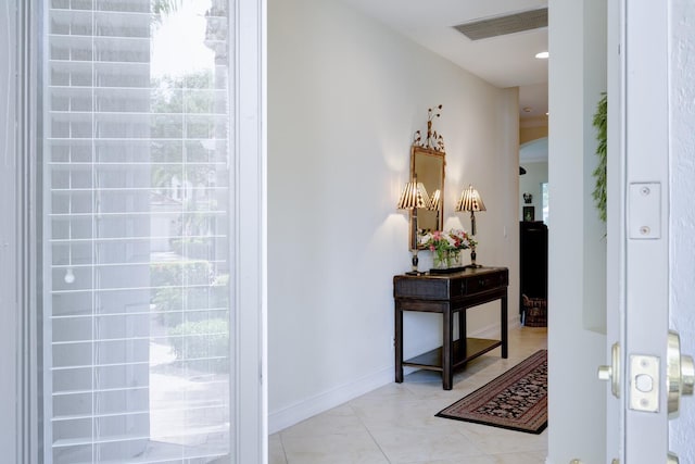 112 Palm Bay A Dr Unit A, Palm Beach Gardens, FL 33418 - entrance foyer featuring arched walkways, light tile patterned floors, and baseboards