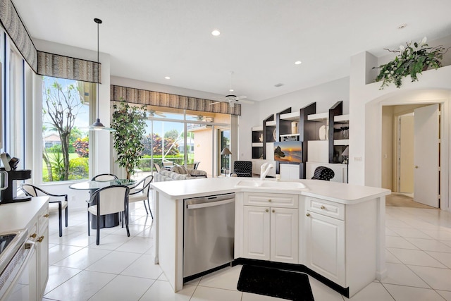 4498 Hazleton Ln, Lake Worth, FL 33449 - kitchen featuring dishwasher, a sink, light countertops, range with electric cooktop, and open floor plan