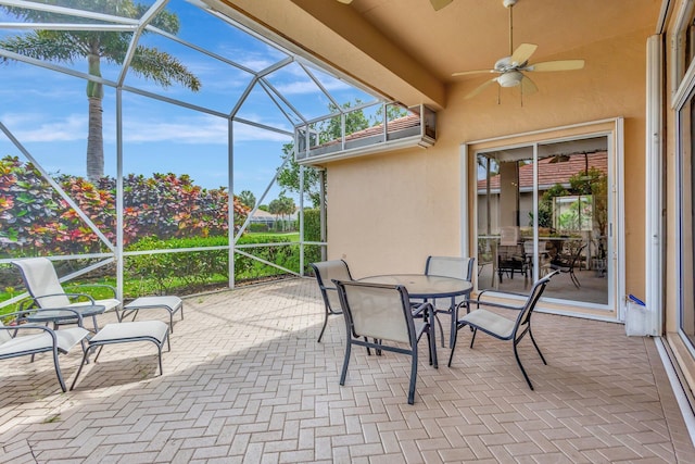 4498 Hazleton Ln, Lake Worth, FL 33449 - view of patio with a lanai, a ceiling fan, and outdoor dining space