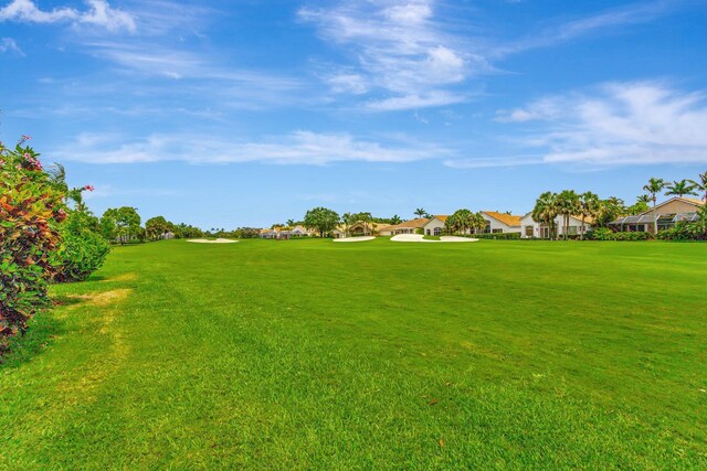 4498 Hazleton Ln, Lake Worth, FL 33449 - view of green lawn featuring a residential view