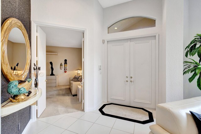 4498 Hazleton Ln, Lake Worth, FL 33449 - foyer entrance featuring light colored carpet and light tile patterned floors