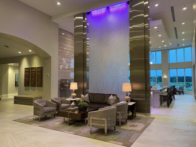 4498 Hazleton Ln, Lake Worth, FL 33449 - common area featuring a towering ceiling and recessed lighting