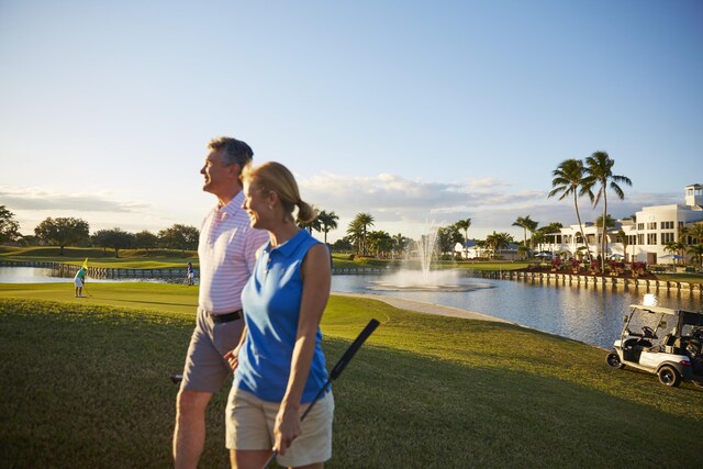 4498 Hazleton Ln, Lake Worth, FL 33449 - view of home's community with a water view and a lawn