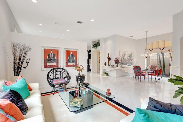 4498 Hazleton Ln, Lake Worth, FL 33449 - tiled living room with a chandelier, arched walkways, and recessed lighting