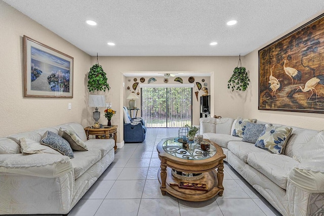 6738 Moonlit Dr, Delray Beach, FL 33446 - living area featuring a textured ceiling, recessed lighting, and light tile patterned flooring