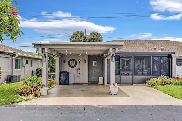 6738 Moonlit Dr, Delray Beach, FL 33446 - view of front of property featuring a sunroom and central AC unit