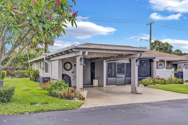 6738 Moonlit Dr, Delray Beach, FL 33446 - view of property with a carport and fence