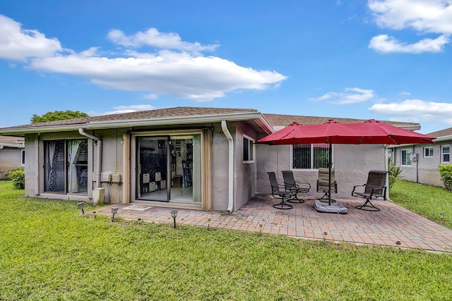 6738 Moonlit Dr, Delray Beach, FL 33446 - back of house featuring a patio area, stucco siding, and a yard