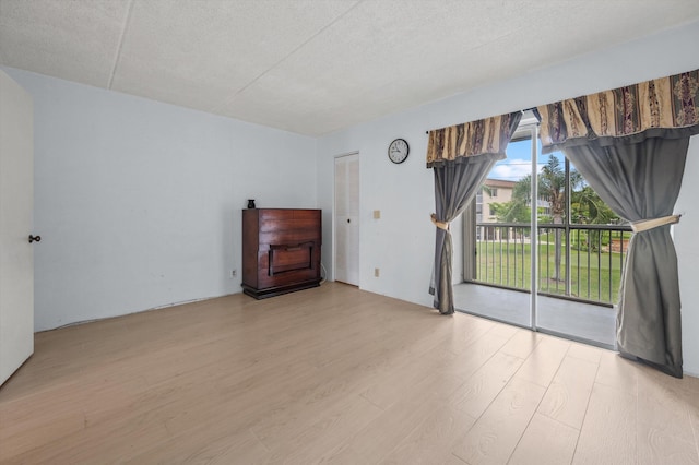 400 Village Green Cir W Unit 205, Palm Springs, FL 33461 - spare room featuring wood finished floors