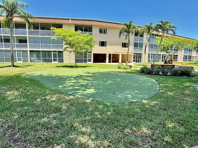 view of community featuring a lawn