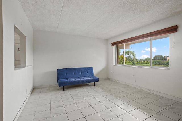 400 Village Green Cir W Unit 205, Palm Springs, FL 33461 - unfurnished room featuring a textured ceiling and baseboards