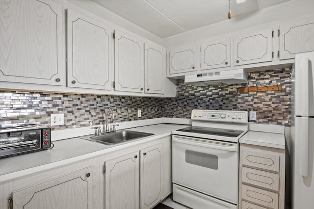 400 Village Green Cir W Unit 205, Palm Springs, FL 33461 - kitchen with white appliances, a sink, light countertops, decorative backsplash, and under cabinet range hood