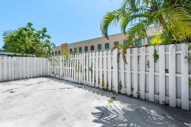 gate featuring a patio area and fence