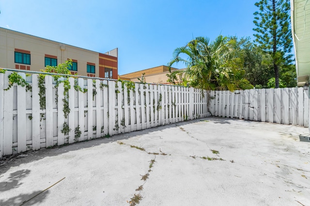 gate with fence and a patio area