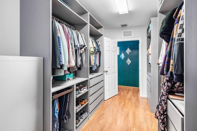 3064 Rostan Ln, Palm Springs, FL 33461 - walk in closet featuring light wood finished floors